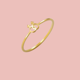 Bague lesbienne double Vénus or, bijou fin représentant l’amour entre femmes sur fond rose