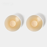 Caches protecteurs en silicone beige clair, adhésif périphérique et protection centrale non collante.