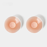 Caches protecteurs rose nude, silicone lisse, zone centrale douce pour protéger la peau lors du binding.